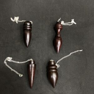 EGYPTIAN EBONY PENDULUM